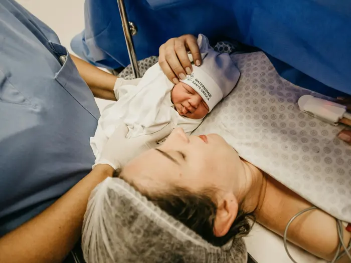 Newborn infant and mother.