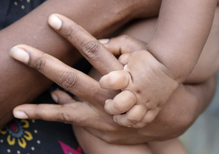 Kokopo Day 2 10 Mother Child Hands 1380X660